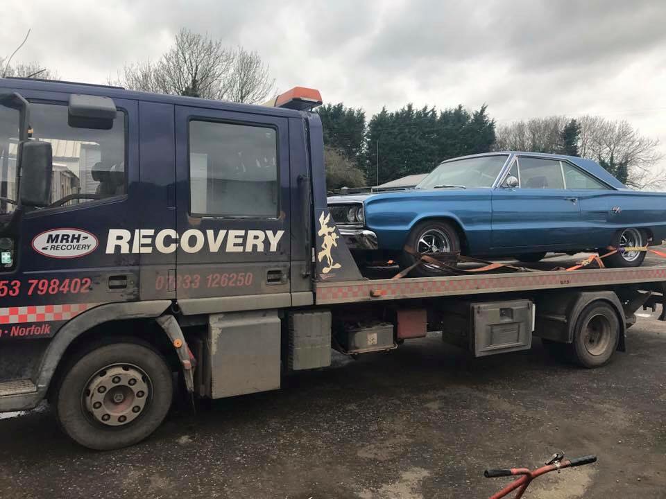 Car on recovery vehicle